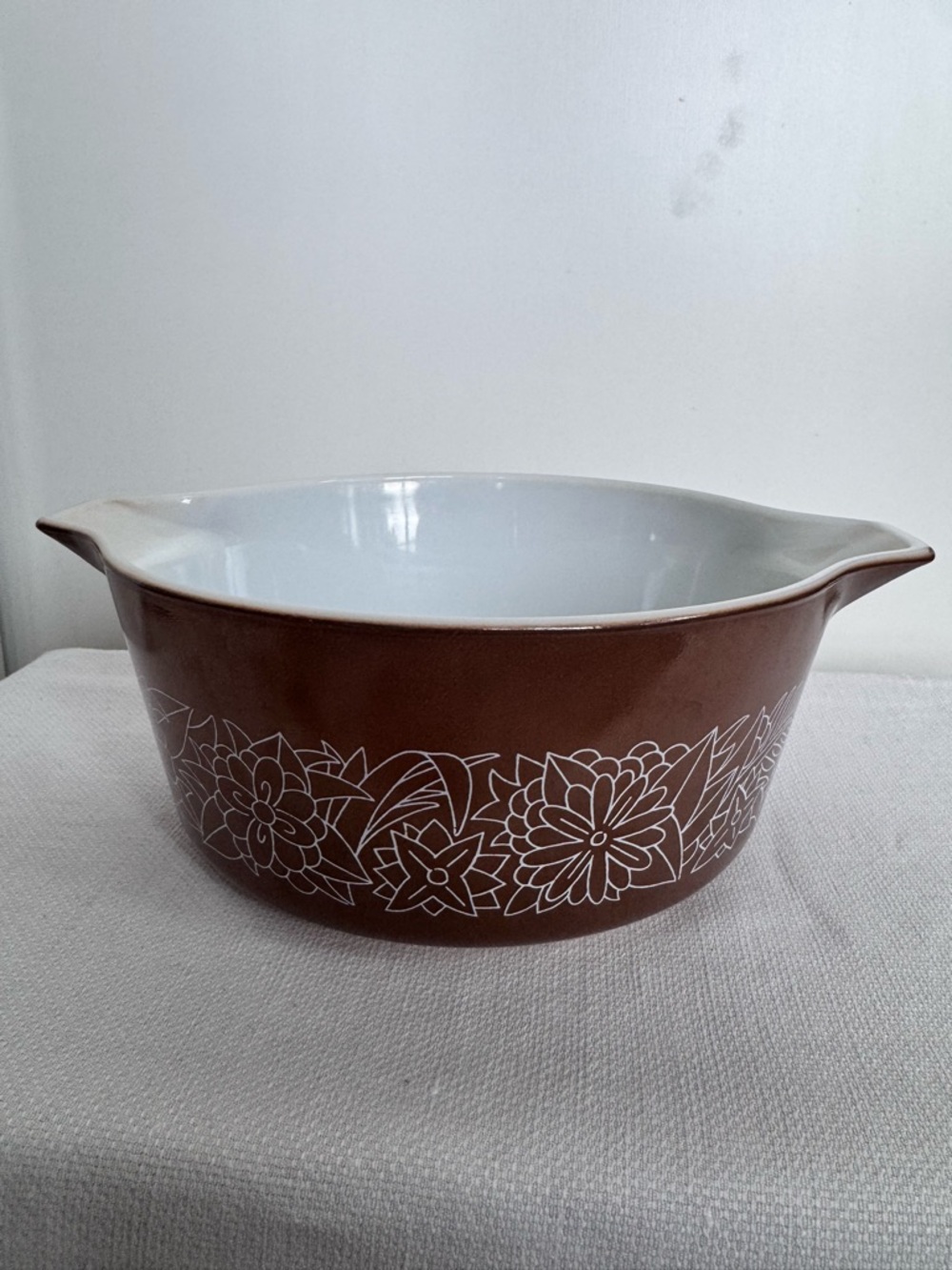 Vintage Pyrex glass casserole dish in the 'Woodland' pattern